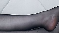 From another point of view, Anna's black pantyhose, legs and feet.