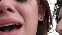 The girls are smoking cigarettes in the street and then they go home for a lesbian threesome